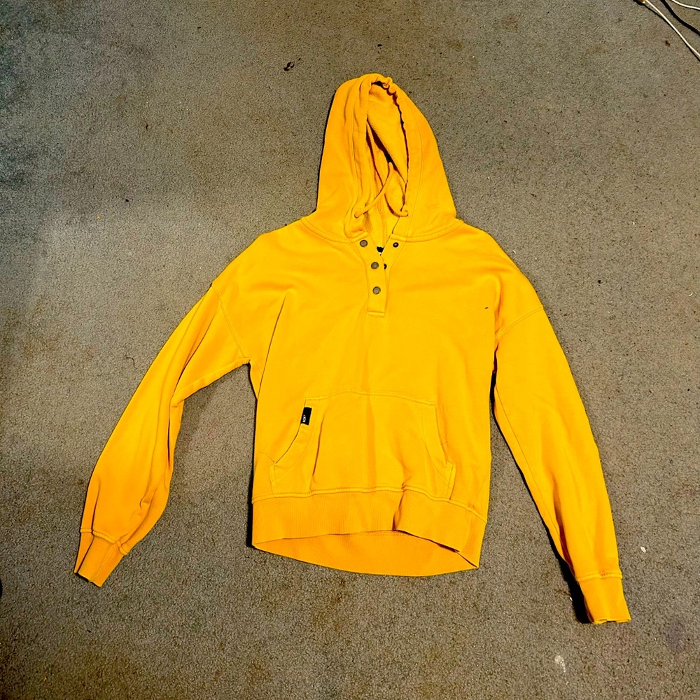 This hoodie is yellow, size small and brand is “Roxy”